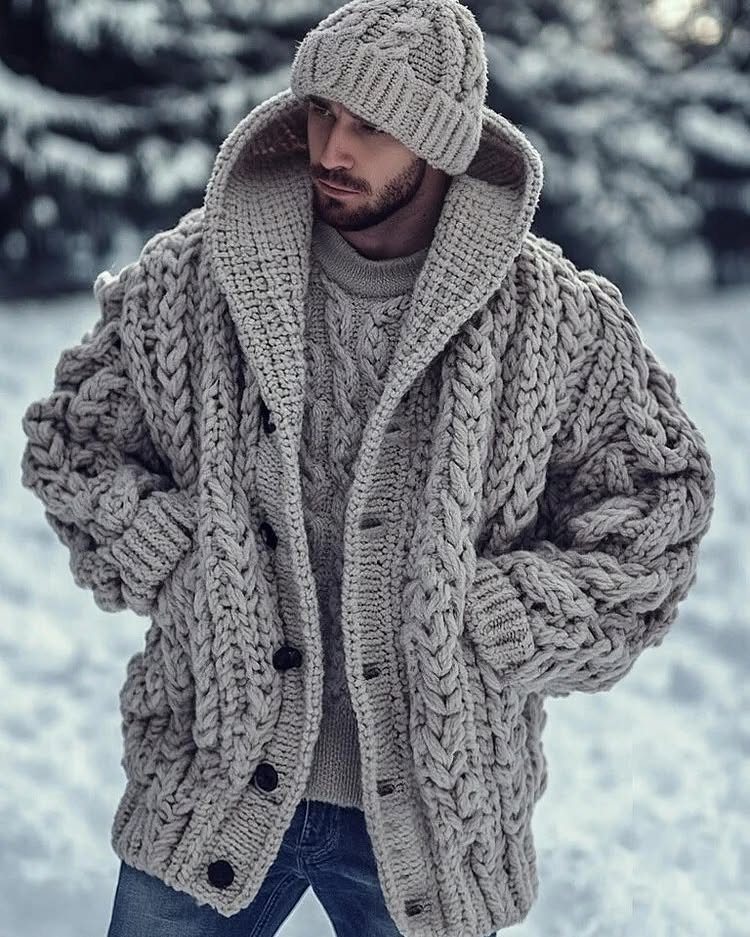 Man in chunky gray hooded cardigan and matching sweater in snowy landscape
