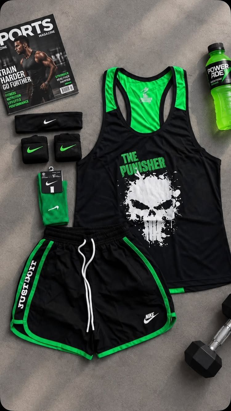 Black tank top with neon green trim and Punisher graphic among gym accessories.
